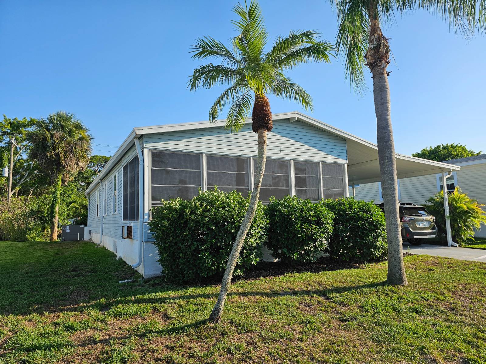 This home1997 home with 2Bed/2Bath, 2020 A/C, 2015 Roof, 2018 Water heater and sits exterior of the community with no one behind you for a private backyard setting. Home has two entries, one through your Lanai and the other through the Front Florida Room and a large storage/workshop for all your outdoor needs.   Home has inside laundry for convenience with plenty of upper cabinets and shelves and comes fully furnished with a large master bedroom with master bed and ensuite with shower, a 2nd bedroom with double beds for your guests. Vaulted ceilings give this home that spacious relaxing feeling. The dining room off the front of the home with corner windows for plenty of light. The kitchen has an abundance of updated cabinets and all appliances included.  Home is in the most desirable 55+ community of Heron Cay, located just minutes from Vero Beach.  Come live a Resort Style Life with all the amenities included, such as pickleball, tennis, bocce, horseshoes, resort pool with pool aerobics, workout room just minutes from your doorstep and a sauna and jacuzzi for relaxation. Stay active with all the activities such as trivia, bingo, dances, social hour, BBQ, ice cream day and more. Make every day a vacation and start your retirement life with the enjoyment of the community and minutes from beautiful beaches, tiki bars, beachside restaurants and more. Park approval is required, call the listing agent today for your showing or for park requirements.