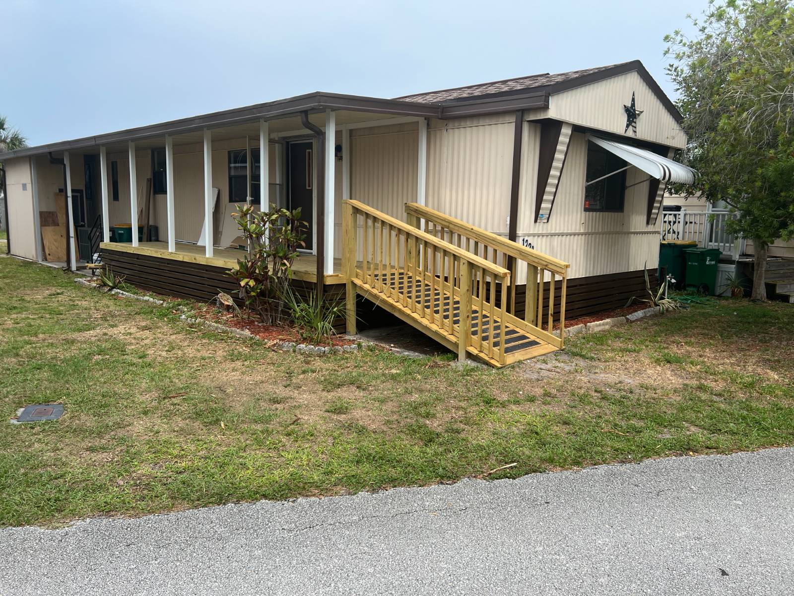 MAKE IT YOUR OWN.  This 1984, 14 x 60, 2 bedroom, 2 bath mobile home has all the major upgrades done! New roof 2024, New AC 2021, New Deck 2024, New plumbing and toilets,  New ceiling fans, and electrical upgrades are done.  You pick your flooring in the bedrooms and bathrooms, paint, and finishes.  Disclaimer:  Photos with furnishings are prior to renovations. Finish this project your way, and pay the lowest lot rent known to me. Only $206 per month ! (Current owner) Lot rent includes cable and trash pick up.
