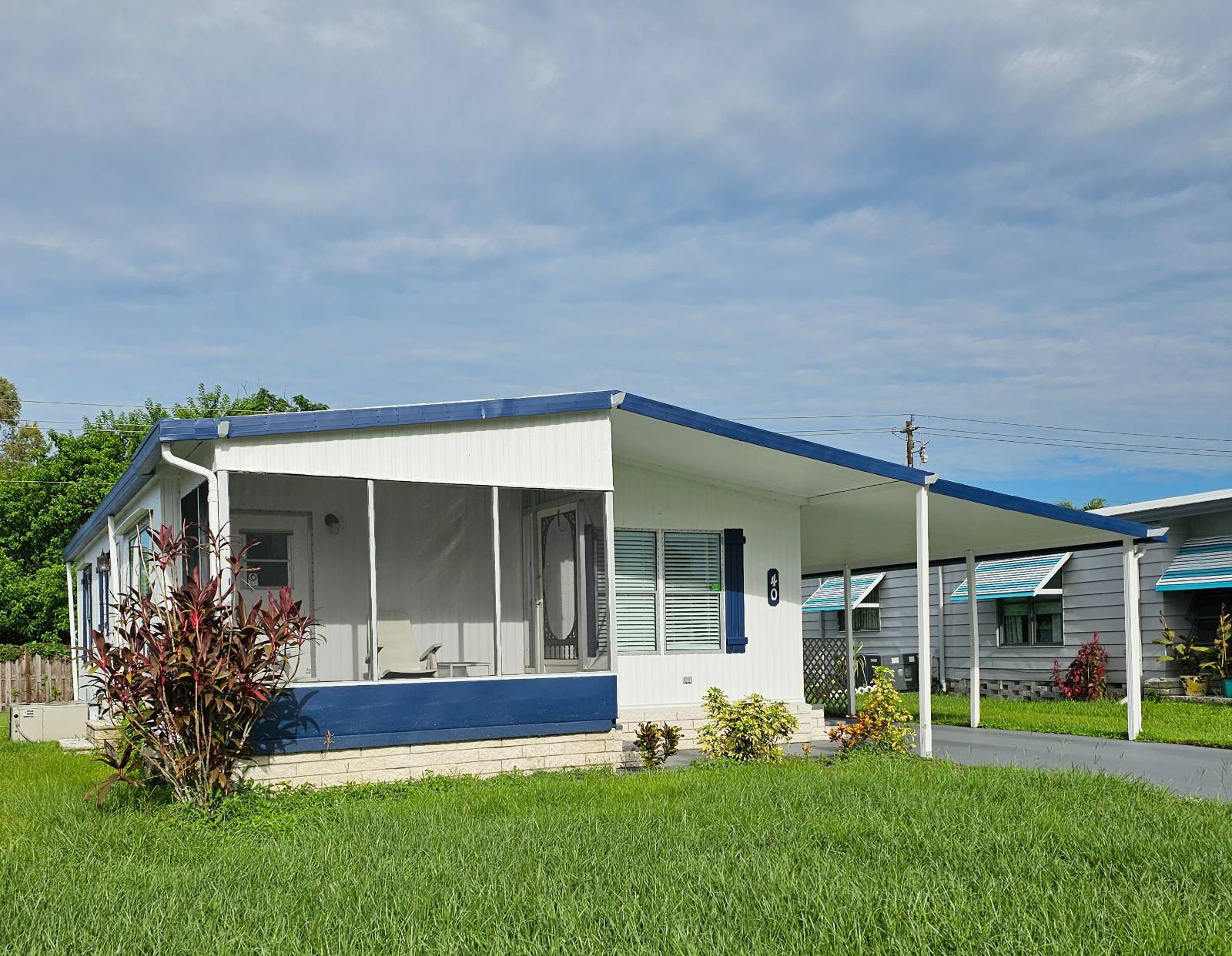 Experience the best of resort-style living in this newly renovated 2-bedroom with BRAND NEW A/C, 1.5-bath home, located in a peaceful Countryside Community in Vero Beach. This home features brand-new flooring, updated bathrooms, and fresh paint throughout, giving it a modern and inviting feel.  Enjoy the convenience of a utility room with a washer and dryer, accessible right off the carport. The home boasts a solid rubber roof, recently sealed.   Situated on the exterior of the community, this home offers a private backyard-perfect for enjoying the Florida sunshine. The community itself offers a range of amenities, including a clubhouse with swimming pool, jacuzzi, sport courts, workout room, crafts and more. Socialize with the community array of actives.  Located just 9.5 miles from the beach and downtown Vero Beach, this home provides easy access to all the best local attractions. It's the ideal size for MOM or DAD, or for those looking for low-maintenance living in a vibrant 55+ community.  Don't miss out on the opportunity to live the beachside lifestyle at a fraction of the cost. Contact the listing agent today to schedule a showing and make an offer! Park approval is required for purchase.