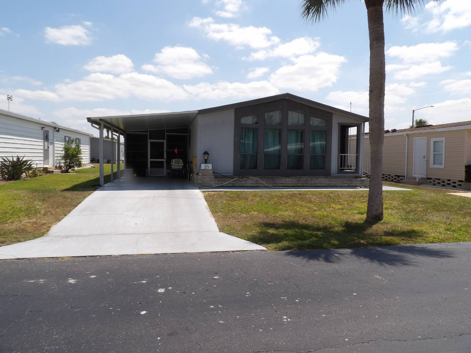 Spacious 2 Br 2 BA 24 X 57 mobile home with 240 SQ FT FL room offers 1608 SQ FT of living space. This home has a unique open floor plan that positions the living room and the family room (with wet bar ) on either side of the kitchen, and adds the dining room, providing many relaxation possibilities. Updates include the 2020 carrier AC. newer rubber roof, and newer appliances, including the washer and dryer. All this plus lots of storage. The home is located close to the office and has easy access to the community amenities and clubhouse. Have to see to appreciate.