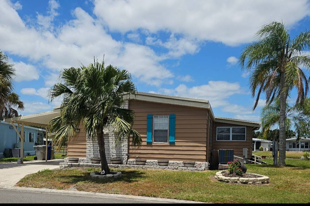 Welcome to Vero Beach Florida!  Water lot! Beautiful two bedroom two bath home in a 55+ active community  Welcome to your newly renovated lakefront home in the desirable 55+ active community. This property features extensive upgrades throughout combining modern convenience and spectacular views.  Brand new flooring throughout, completely renovated kitchen with cabinetry and countertops, including a butcher block which  gives you added counter space.  Upgraded bathrooms for modern comfort. In addition the guest bathroom has a classic barn door entrance and an extra deep sink and a deep jetted tub.  New electrical  wiring and new panel boxes for safety and reliability, New AC system and ductwork for efficient climate control.   Stainless steel appliances in the kitchen, New light fixtures, and ceiling fans.  Listen up ladies! Laundry room is in the home.  The upgrades don't end with the inside of the home.  Exceptionally well built deck overlooking the lake perfect for enjoying evening sunsets.  Large lanai, providing a gracious entry to your home.  Spacious 9 x 18 storage shed offering ample space for your needs  This moving ready home offers both comfort inconvenience in a Vibrant community setting with the added benefits of serene water views don't miss this opportunity to enjoy resort style living at its best.  Call to set up an appointment to see this beauty.