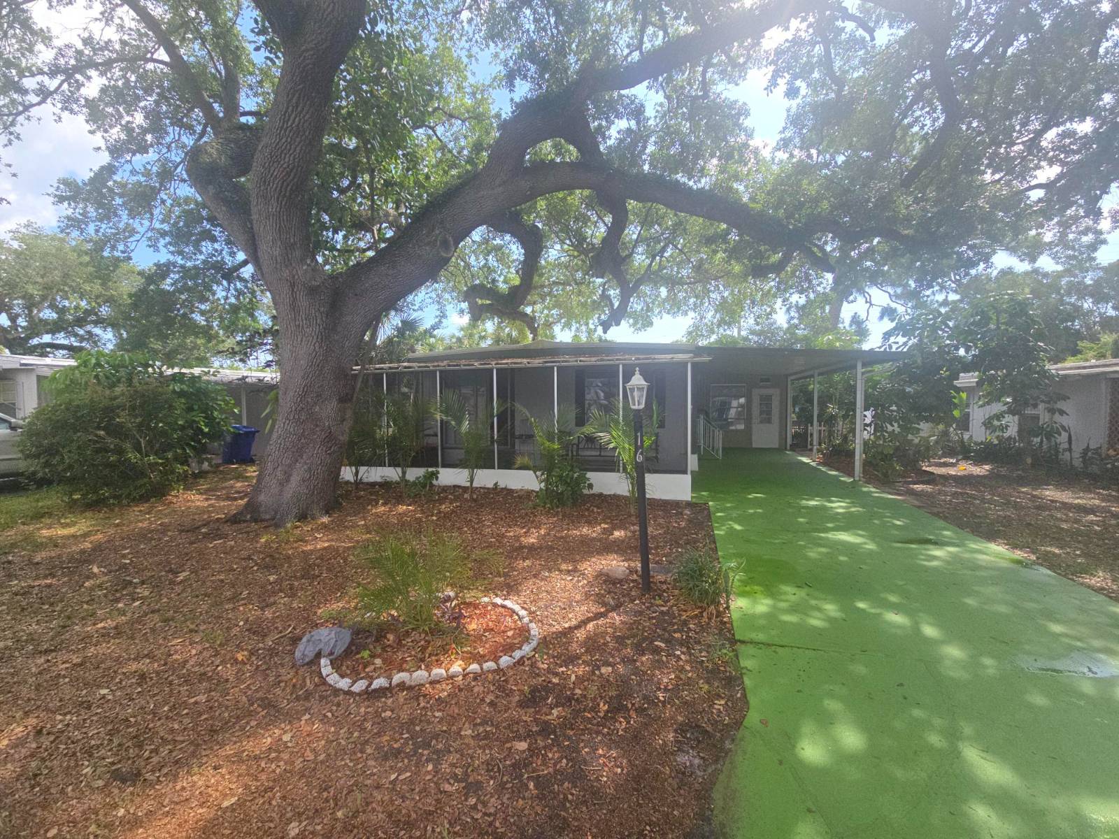 Welcome to Woodlawn Manor Mobile Home Park, one of the best-kept secrets in town! This charming 2-bedroom, 1-bath home sits on a shaded lot with a private backyard, offering peace, privacy, and affordability in a well-maintained community. The home features a bright and open kitchen with a breakfast bar, stainless steel appliances, and is already plumbed for a dishwasher. Enjoy meals in the adjoining dining room and relax in the huge living room with plenty of natural light. The flooring is a stylish mix of vinyl plank, Tile, and laminate throughout. Additional highlights include Recently resealed roof, Central A/C, Ceiling fans, Washer & dryer included, Expansive 24x10 Florida Room-perfect for entertaining or enjoying your morning coffee, Large laundry/storage room plus an extra exterior shed. Community amenities at Woodlawn Manor are impressive, with a beautiful clubhouse, sparkling pool & sundeck, billiards, library, on-site laundry, shuffleboard, and more-all while offering one of the lowest lot rents in the area! Don't miss this opportunity to enjoy affordable Florida living in a vibrant, active 55+ community. Schedule your private showing today!