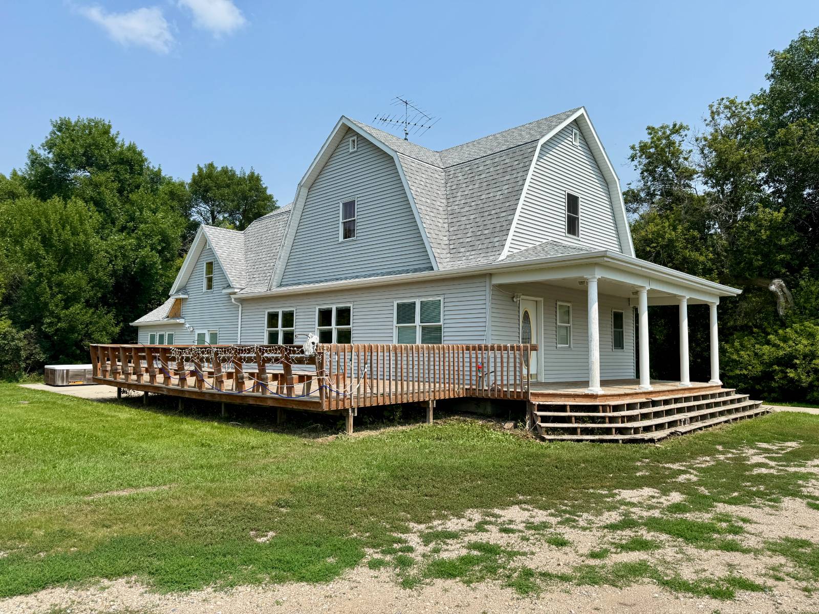 Discover this expansive 7-bedroom, 2.5-bathroom home nestled on 13.39 acres, offering the perfect blend of space, functionality, and country living. The property features a large insulated and heated shop (78' x 46'), a detached 2-car garage (24' x 30'), two barns, multiple outbuildings, and several grain bins, providing ample storage and workspace for hobbies, farming, or business needs. The home itself boasts a large kitchen with abundant cabinetry, main floor laundry, and generous living spaces ideal for a growing household. A new roof installed in 2025 offers peace of mind for years to come. Enjoy the wide-open outdoor space, perfect for recreation or expansion, with mature trees surrounding the property for privacy and scenic views. Property Sold "As Is"